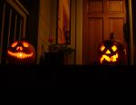 17 Jack-o-Lanterns on the front porch at night