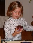 22 Carla holding a cupcake for the first time - she's not sure she likes it.