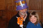 35 Amaia thinks Grandpa John looks silly wearing her Halloween trick-or-treat bucket as a hat