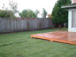 47 Deck and fenced backyard. Gate behind the tree opens to a county park.